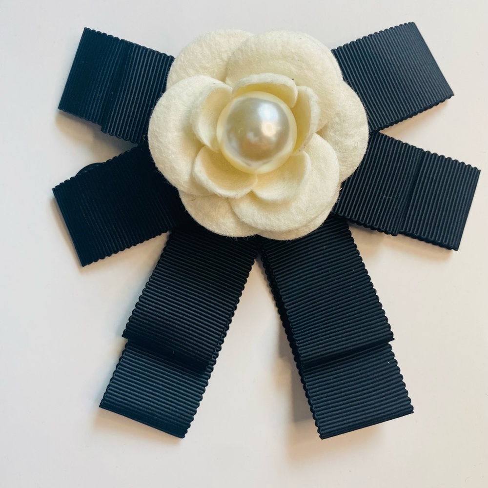 White camellia brooch with pearl and bow